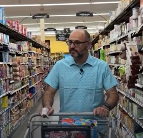 Yevgeny goes grocery shopping for snacks for his students.
