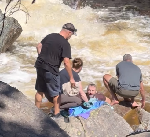An off-duty cop jumped into the water to save a swimmer.