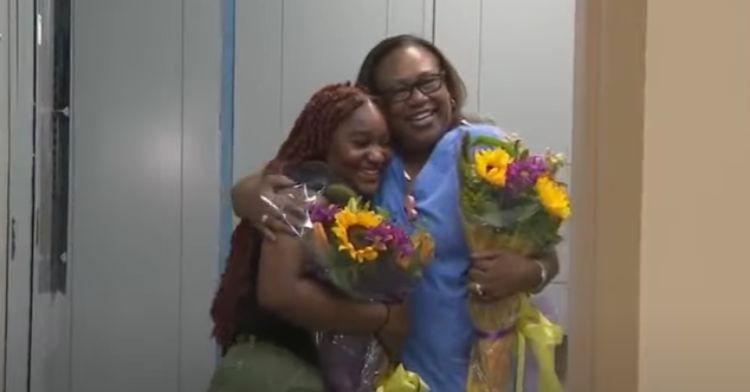 Victoria hugs the hospital worker who found her as a baby.