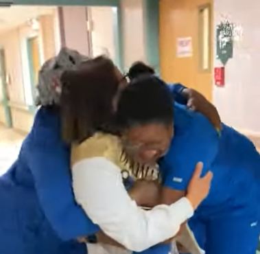 women hugging each other at the hospital