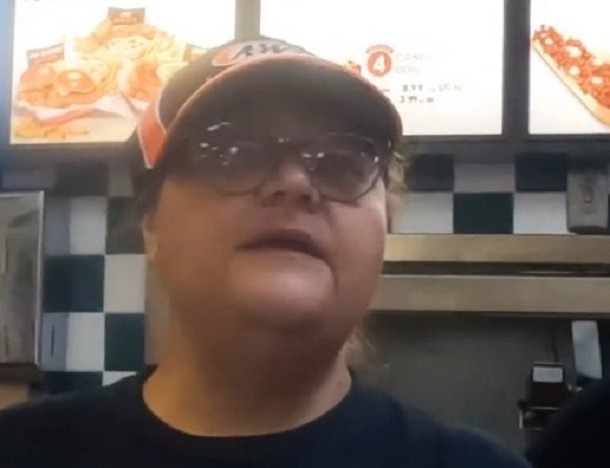 Woman behind the counter at a fast food establishment