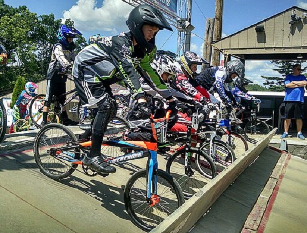 BMX Racers lined up at the starting gate for a race.