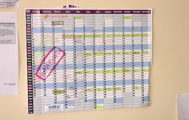 Image shows a yearly wall calendar in a spreadsheet display, with several items written on it.
