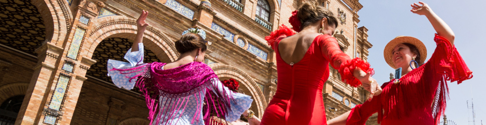 Ladies dressed in red dance in the street.
