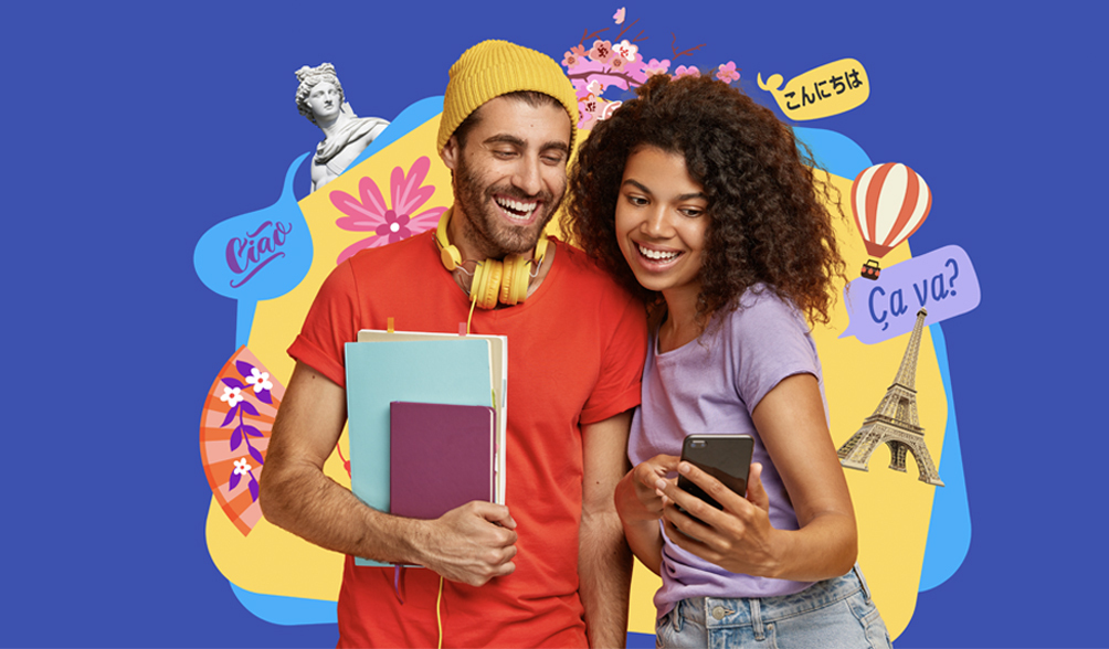 A man and a woman smile wide as she shows him her phone which has Rosetta Stone on it. Behind them are various iconic images from around the world and text in various languages.