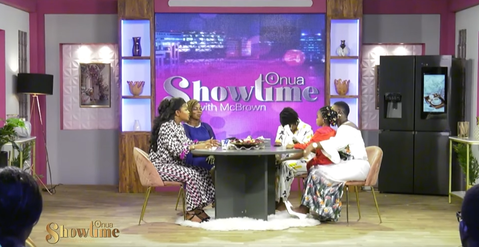 Abigail Adjiri, her Mom, Nana Ama McBrown, and a fourth person sit around a table on the show "Onua Showtime with Nana Ama McBrown."