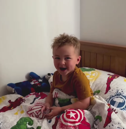 Child laughing over his pet moth's name.