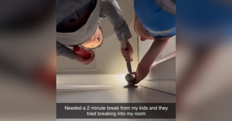 Two kids are trying to use a flashlight and a butterknife to break into a bedroom. We see this from the angle of a camera that has been slid under a door.