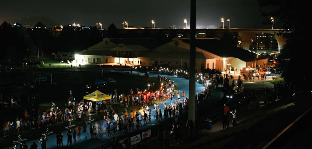 Aerial view of the Cameron Bean Memorial 5K in Chattanooga, Tennessee after lightning struck and the lights went out, leaving those in the crowd using their phones like flashlights.