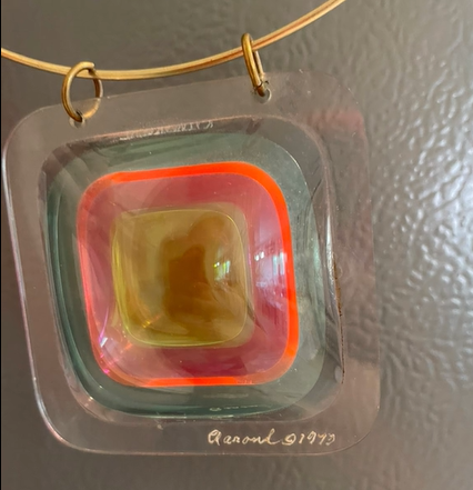 multicolored pendant with signature and date