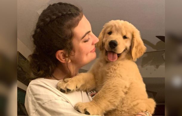 Alison Appleby pictured with her epilepsy service dog Brady as a puppy.