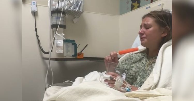 Image shows a tonsillectomy patient eating an orange popsicle after surgery.