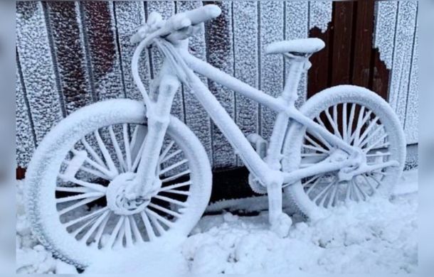 Image shows a bike left out in the snow in Iceland.