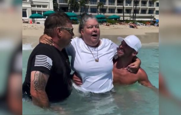 woman in wheelchair swims in ocean for first time