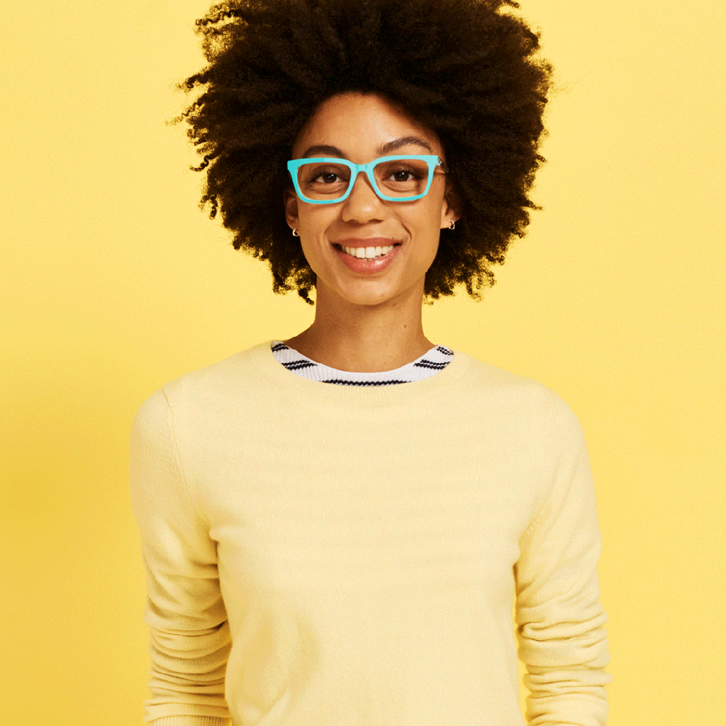 gif of a woman wearing yellow trying on several pairs of magnetic glasses