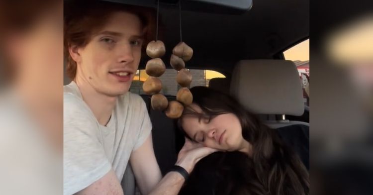 This supportive boyfriend keeps his girlfriend safe.