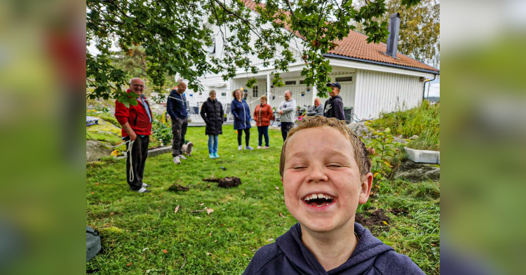 family in garden with hole