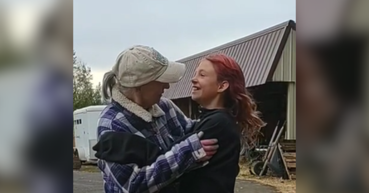 girl and older woman embrace