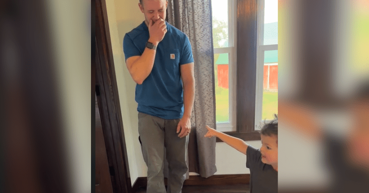 guy laughing with baby pointing