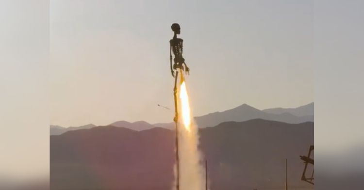 An unusual skeleton rocket is launched into the air.
