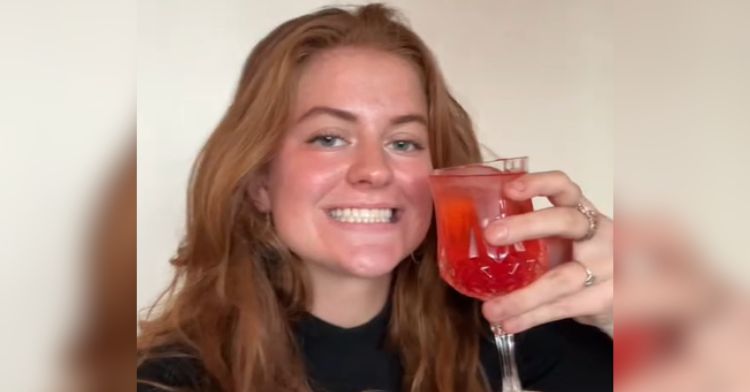 A woman treats herself to a Shirley Temple.