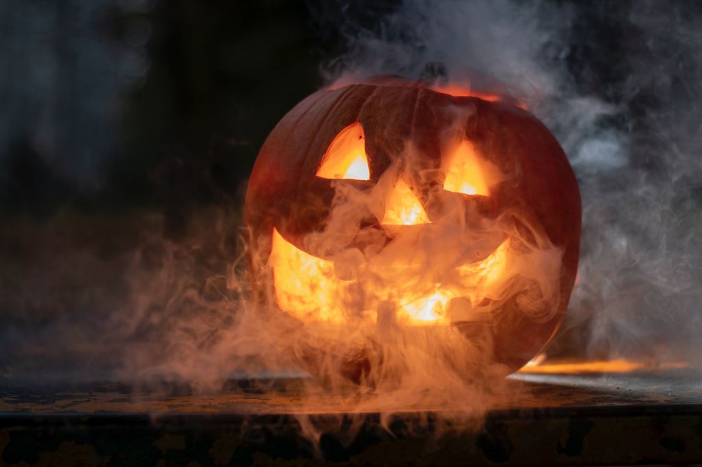 Jack-o-lantern with smoke coming out of it.