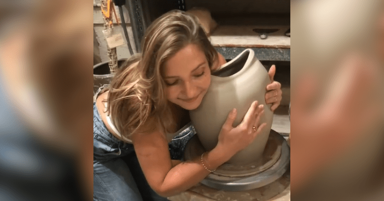 woman hugs pottery