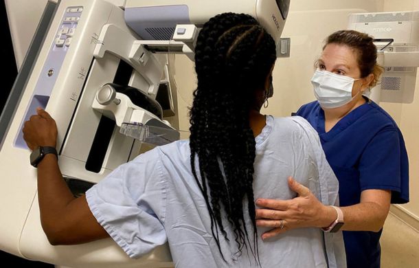 Mammograms are an integral part of breast cancer prevention. Image shows a woman getting a screening.