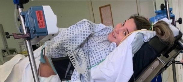 Woman on a hospital gurney after having an epidural procedure before a C-section.