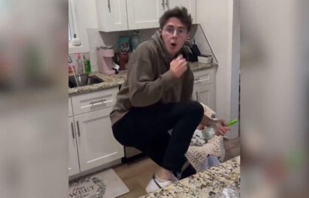 dad dancing for his infant son is frightened when he turns around and sees his wife recording him.
