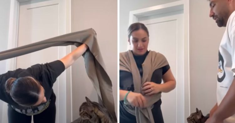 Trying to put on a baby sling.