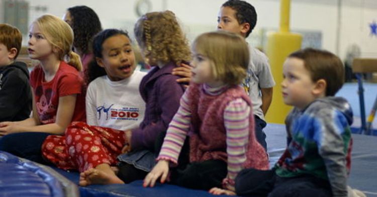 Image shows several kids with no filter talking to one another.