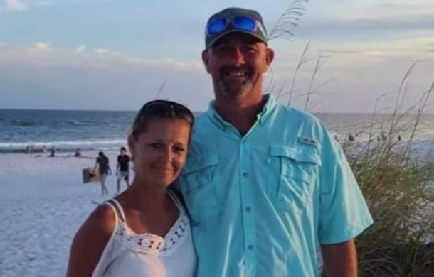 Texans Josh and Tina Fey standing on the Florida beach where they helped rescue a stranded shark.