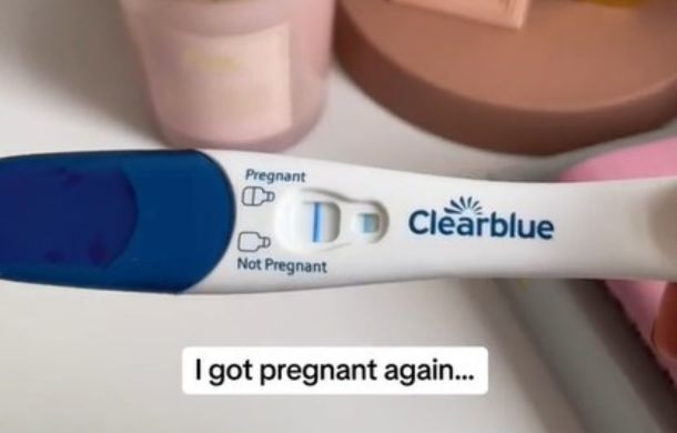 Image shows a positive Clear Blue pregnancy test.