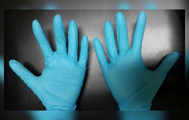 Rubber gloves of love. Image shows blue medical-grade rubber gloves.