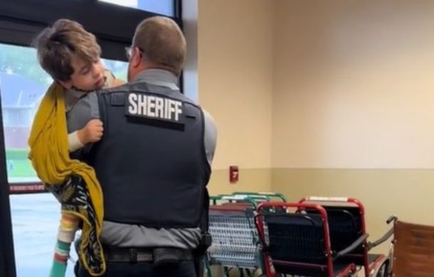 Beckett's adoptive father carries him out of the hospital