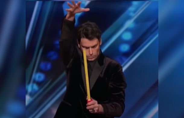 Image shows a man holding a tape measure that is extended. He is pretending to use telekinesis to manipulate the tape.