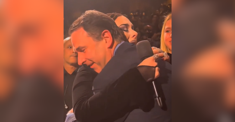 adele hugs doctor with mic in hand