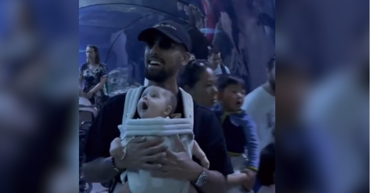baby awestruck in aquarium