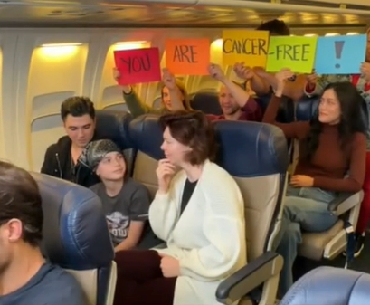 A boy finds out he's cancer-free on an airplane.
