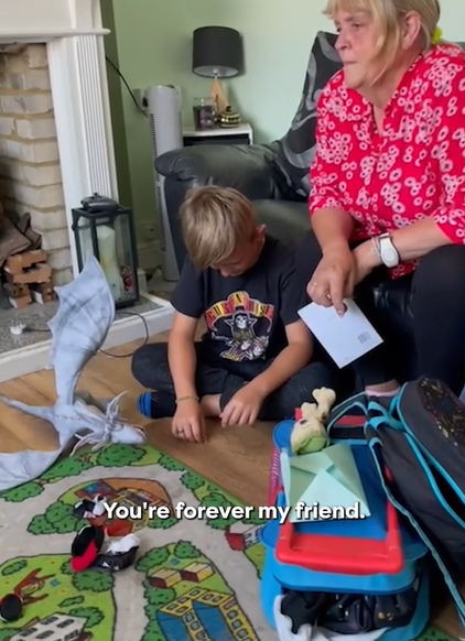 A little boy sits on the floor. His head is down, and it looks like he's crying. A woman sits next to him on a couch. Text on the image reads "You're forever my friend."