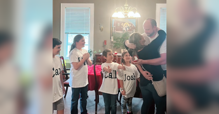 Children watch as mom and dad hug after proposal