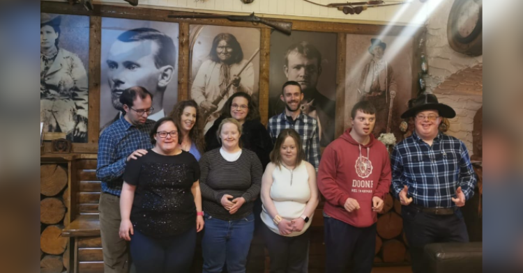 group of special needs individuals taking photo