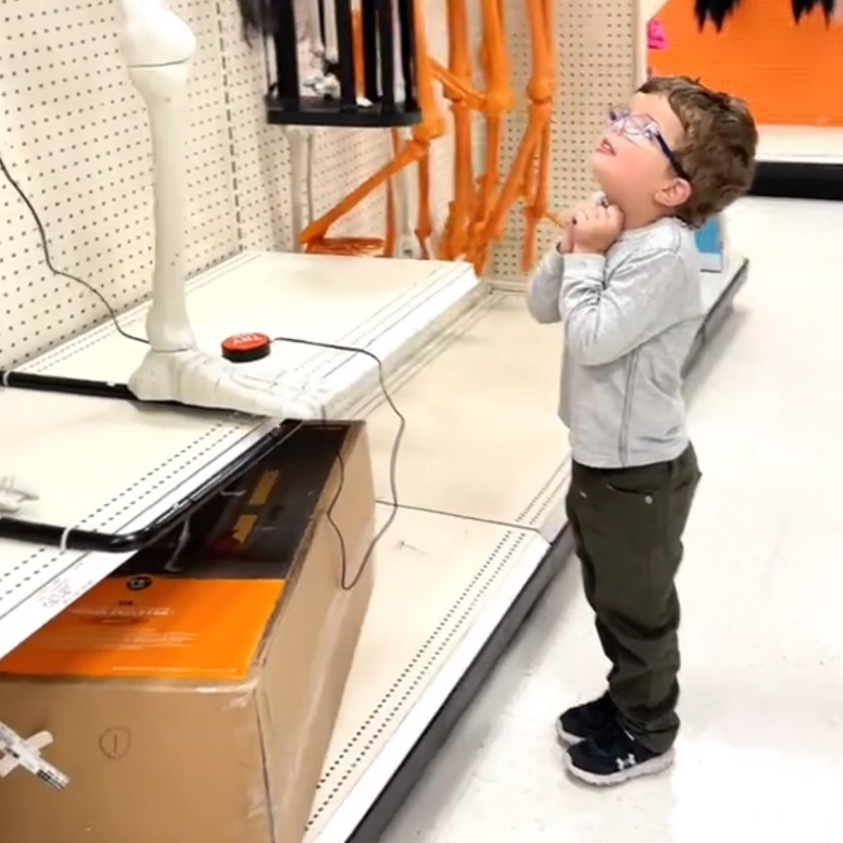 deaf boy enjoys skeleton dancing with his hearing aid out