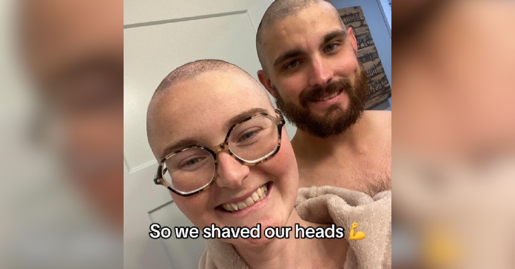 Chelsea, a woman with a shaved head, smiles as she takes a selfie with her husband who also shaved his head. Text on the image reads: "So we shaved our heads."