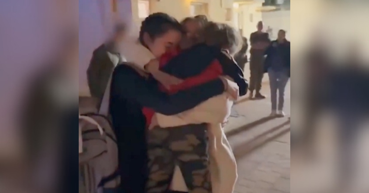 Maayan Zin holds on tight to her two daughters, Ella and Dafna, after they were released from Hamas.