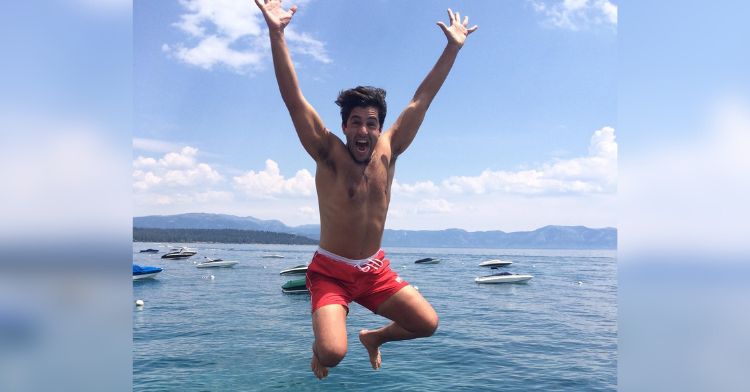 Comedian Josh Peck jumping into the water.