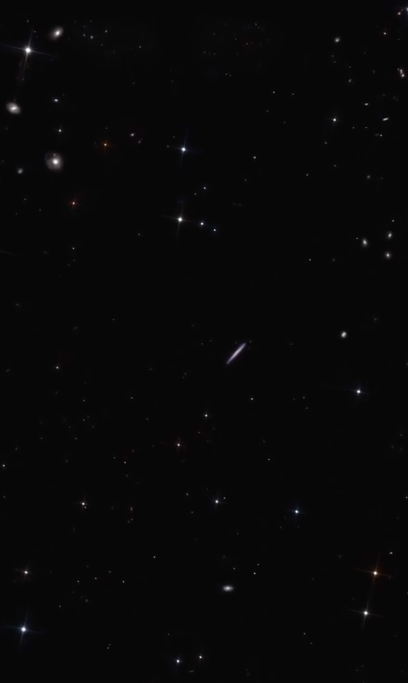 A zoom-in of space. It's mainly black with lots of bright white spots.