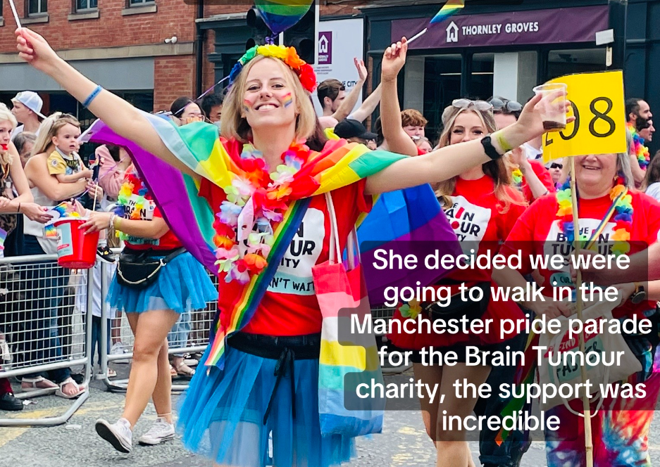 A crowd of people marching in a pride parade, including this woman's sister who has since died of brain cancer