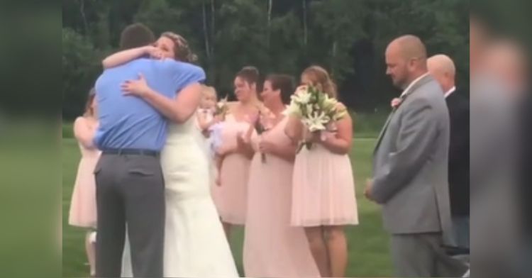 A bride hugs her son's organ donor recipient at her wedding.
